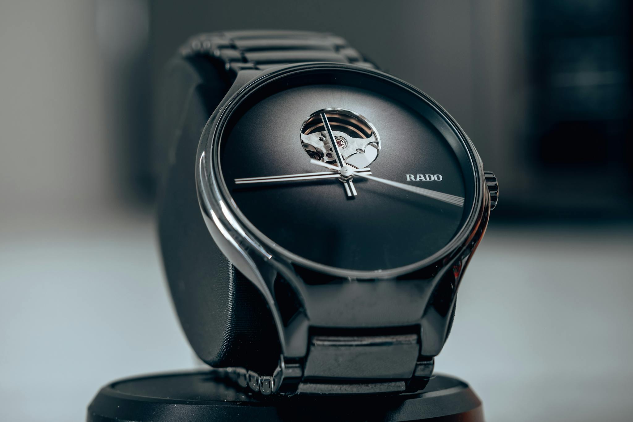 Close-up shot of an elegant black wristwatch showcasing modern luxury design.